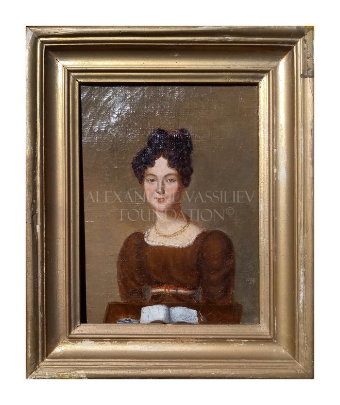 Portrait of a woman in brown reading